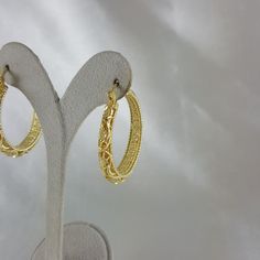 Elevate your style with these enchanting filigree earrings, designed to evoke admiration and elevate your festive looks, making them an ideal Christmas gift that exudes grace, elegance, and enduring beauty. 18K Gold Plated Floral Filigree Design Length: 40mm I 1.6 inch Width: 6mm I 0.2 inch , 13 grams Elegant Hoop Earrings With Intricate Design For Wedding, Elegant Small Hoop Earrings With Intricate Design, Elegant Intricate Hoop Earrings For Wedding, Wedding Hoop Earrings With Intricate Design, Filigree Round Hoop Earrings For Wedding, Elegant Small Hoop Filigree Earrings, Gold Hoop Earrings With Elegant Design, Intricate Design Hoop Earrings For Wedding, Elegant Festive Hoop Earrings