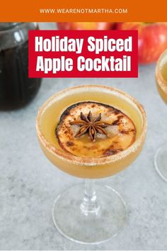 holiday spiced apple cocktail with cinnamon garnish and anise on the rim