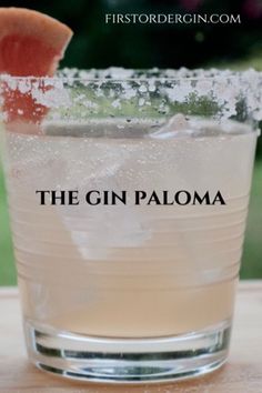 the gin paloma cocktail is garnished with a slice of watermelon