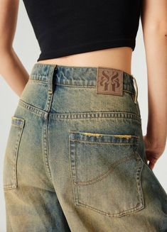 Retro-Inspired Wide Leg Denim Jeans - Embrace a nostalgic look with these wide and baggy fit jeans. Featuring a straight leg design, ripped back hemline, and distressing details, these 100% denim cotton jeans are unisex and perfect for any casual outfit. Available in wash blue, they include a unique SP leather patch on the back. Sizes: Extra Small, Small, Medium, Large, Extra Large SIZE (CM) LENGTH WAIST BUTT EXTRA SMALL 101 69 90 SMALL 104 75 96 MEDIUM 106 79 100 LARGE 108 83 104 EXTRA LARGE 11 Distressed Wide Leg Cropped Jeans In Rigid Denim, Streetwear Cutoff Jeans, Cutoff Jeans For Streetwear With Five Pockets, Faded Distressed Wide Leg Jeans, Acid Wash Distressed Wide Leg Jeans, Distressed Relaxed Fit Flare Jeans In Rigid Denim, Distressed Straight Leg Cropped Jeans For Streetwear, Acid Wash Straight Leg Cargo Jeans, Baggy Faded Distressed Flare Jeans