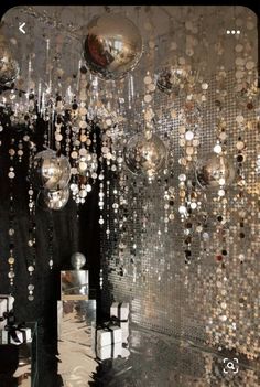 an artistic photo with bubbles and balls hanging from the ceiling