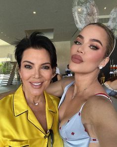 two women are posing for the camera with bunny ears on their head and one is wearing a yellow shirt