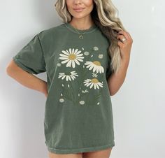 "Daisy T-shirt, Flowers Tshirt, Boho Tshirt, Boho Daisy Shirt, Floral Nature Shirt, Art Nouveau Daisies, Shirt, Graphic, Mothers Day Gift, Summer T-shirts 🌸Material: Crafted with 6.1 oz/yd² of premium 100% Ring Spun US cotton, ensuring superior quality and comfort. 🌸Fit: Features a relaxed fit that is both comfortable and stylish, suitable for all genders and sizes. 🌸Collar: Equipped with a topstitched, classic width, rib collar for a timeless and refined look. 🌸Sizing: Runs true to size, providing a consistent and accurate fit. High-quality, stylish pieces and comfortable t-shirts and sweatshirts! Our collection is crafted from premium materials, ensuring a perfect blend of quality and comfort. For our sweatshirts, we use a mix of cotton and polyester, while our t-shirts are available Cute Green T-shirt With Custom Print, Graphic Tee Printed T-shirt As Gift, Graphic Tee Printed T-shirt For Gift, Cute Printed Green T-shirt, Cute Green Printed T-shirt, Graphic Tee T-shirt As Gift In Green, Printed Short Sleeve T-shirt Gift, Green Short Sleeve Shirt For Gift, Green Graphic Print Top As Gift