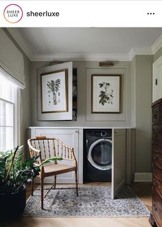 an instagram photo of a washer and dryer in a room with pictures on the wall