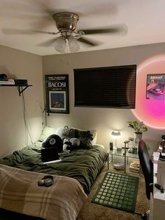 a bed room with a neatly made bed and a ceiling fan