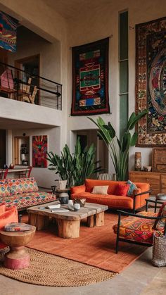 a living room filled with lots of furniture and rugs on top of a floor