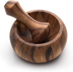 a wooden mortar and pestle on a white background