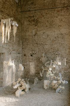 an image of a wedding set up with flowers and candles in the middle of the room