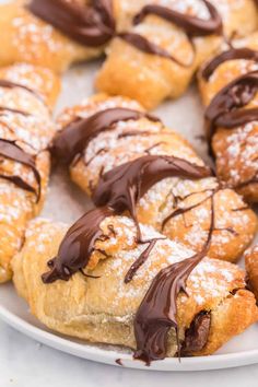 chocolate covered pastries on a white plate