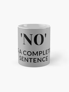 a white coffee mug with the words'no'in black letters on it, and an