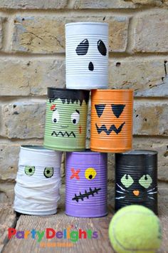 halloween tin can bowling game for kids to play in the yard or on the lawn