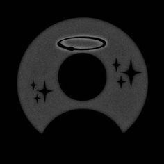 a black and white photo of a circular object with stars in the center on a dark background