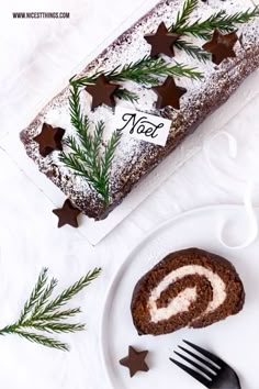 a piece of cake sitting on top of a white plate next to a fork and knife