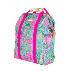 a pink and green floral print bag with straps on the front, sitting against a white background