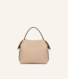 Celebrate natural elegance with our Fleuron bag in sand color. This soft and neutral shade is the perfect complement to any wardrobe. Handcrafted in Italy with grained calf leather, this bag features a beige interior and golden details.