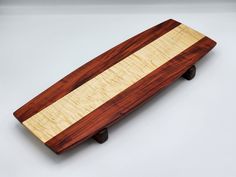 a wooden board sitting on top of a table