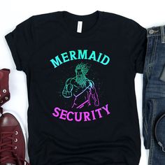 🔱  Whether he's roaming around with his mermaid daughter, or being that awesome Dad at a mermaid themed birthday party, this shirt will leave any father looking like a true king poseidon.  ABOUT THIS PRODUCT:  * Our t-shirts are a soft, high quality 100% ring-spun cotton. Heather colors are an extra soft polyester blend. * Listing photos are a digital mock-up of the design on an actual t-shirt, and accurately represent the final product. * Need it fast? Choose Express shipping at checkout. * Ne Mermaid Themed Birthday Party, Little Mermaid Party, King Triton, Security Shirt, Scuba Gear, Mermaid Theme Birthday, Mermaid Birthday, Mermaid Party, Disney Cruise