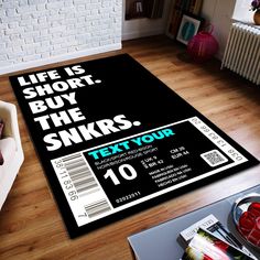 a living room with a large rug that says, life is short buy the snkrs text your 10