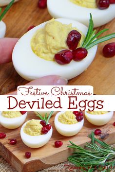 deviled eggs on a cutting board with cranberries and rosemary