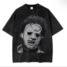 a black t - shirt with an image of the joker