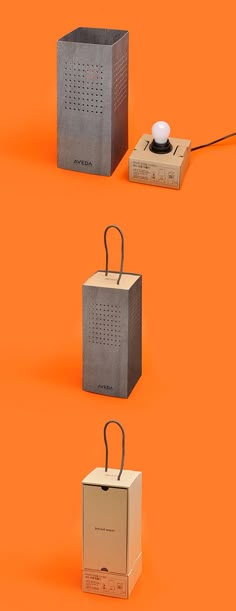 four different boxes with handles on an orange background