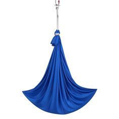 a blue hammock hanging from a metal hook on a white background with clippings