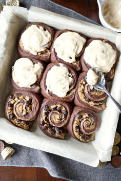 a tray filled with cookies and cream frosting