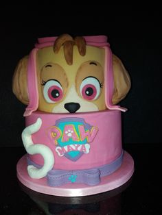 a cake shaped like a dog's head on top of a table