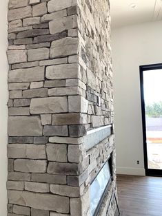 a large stone fireplace in the middle of a room