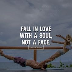 a man and woman doing acrobatic exercises on a dock with the caption fall in love with a soul, not a face