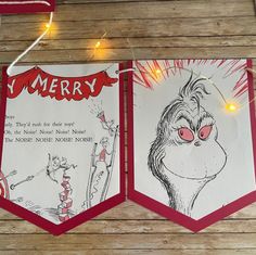 two dr seuss christmas cards hanging on a string with lights around them and an image of the grin