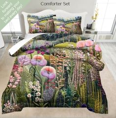 the comforter set is decorated with colorful flowers and plants in an area that looks like it