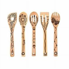 wooden spoons and forks are lined up in the shape of flowers, leaves and butterflies