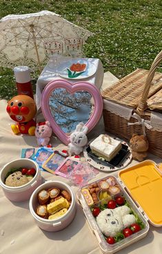 an assortment of food on a picnic table