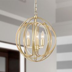 a chandelier with three lights hanging from it