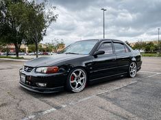 a black car parked in a parking lot