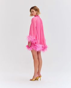 The Pleated Feather Trim Mini Dress is part of the Spring 2023 Runway Collection. This A-line dress features hand-dyed genuine Ostrich feather trimmed sleeves and hem, and a back button closure. Incorporating pleats, this mini dress is fully lined. Made in Brazil. VEC24295US Spring 2023 Runway, Flamingo Fashion, Costume Wedding, Ostrich Feather Trim, Feather Trim, Ostrich Feather, Ostrich Feathers, Runway Collection, Spring 2023