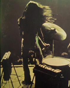 an image of a man playing drums on stage