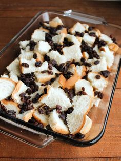 a casserole dish filled with bread and raisins