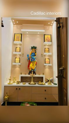 a statue in the middle of a room filled with gold and other items on display