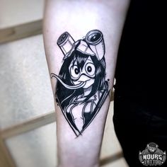 a cartoon character tattoo on the arm