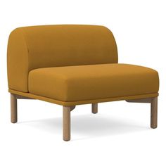 an orange couch sitting on top of a white floor next to a wooden frame and legs