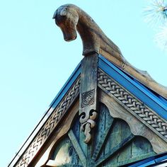 the top of a building with a gargoyle on it's roof