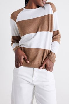 Raglan is a timeless design element, provide a relaxed and sporty aesthetic, offering a modern twist to a classic silhouette. The comfortable fit and breathable fabric make this sweater a perfect choice for year-round wear, whether you're heading out for a casual day or cozying up indoors. Relaxed fit Round neck Long sleeves Stretchy fabric Modern White Sweater With Ribbed Cuffs, Beige Sporty Sweater For Fall, Sporty Beige Sweater For Fall, Modern White Sweater For Fall, Modern White Sweatshirt For Fall, Brown Relaxed Fit Sporty Sweater, Sporty Beige Relaxed Fit Sweater, Sporty Brown Sweater For Fall, Sporty Brown Fall Sweater