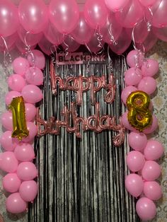 balloons and streamers are arranged in front of a happy birthday sign with the number thirteen on it