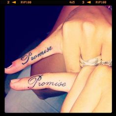 two people with matching tattoos on their arms and feet, one has the word romaine written in cursive writing