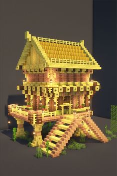 a house made out of lego blocks with stairs leading up to the roof and windows