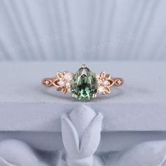 Vintage Green Sapphire Engagement Ring Delicate Pear Wedding Ring Gold Moissanite Inspire Leaf Unique Handmade Anniversary Gift for Her PRODUCT SUMMARY Metal Type: yellow, white or rose solid 10K/14K or 18K gold. Size: All sizes are available, contact me if they do not contain the size you want in the drop-down menu. ☪☪Engagement ring ⚜Center Stone - lab grown olive green sapphire Cut - pear Size - 6x8mm,about 1.3 ct ⚜Side Stone - Moissanite or diamond Cut - Round Weight - 0.12ct Clarity - SI-VS Frog Engagement Ring, Pear-shaped Moissanite Wedding Ring, Green Pear-shaped Diamond Wedding Ring, Pear-shaped Fine Jewelry For Weddings, Pear-shaped Moissanite Wedding Jewelry, Wedding Teardrop Ring With May Birthstone, Teardrop May Birthstone Wedding Ring, Teardrop May Birthstone Ring For Wedding, Green Sapphire Ring Engagement