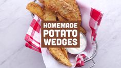 homemade potato wedges in a basket with ranch dressing