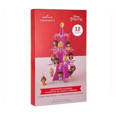 the disney princess christmas tree is shown in its original packaging, and it's pink